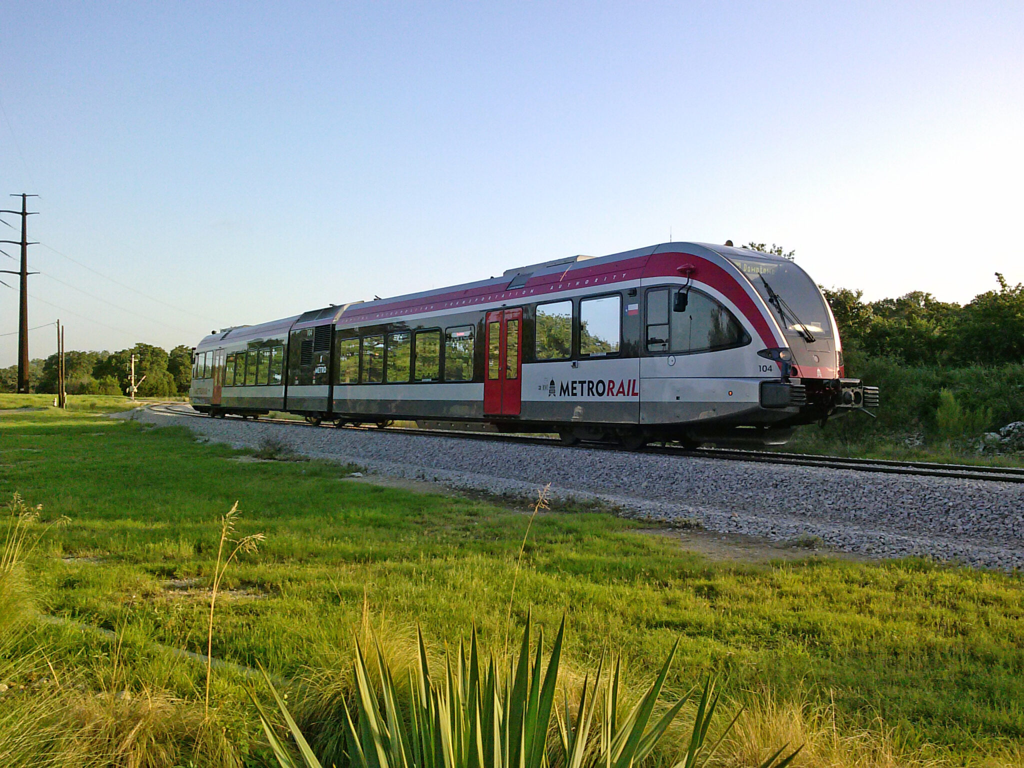 Capital Metro MetroRail DMU approaching a station